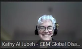 photo of kathy al jubeh on zoom with headphones on smiling